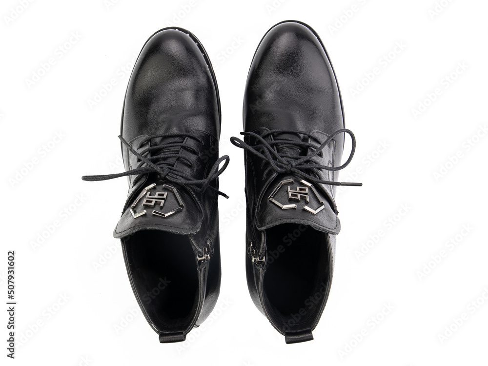A pair of classic leather elegant men's shoes isolated white background. Groom's stylish black shoes. Isolated object close up on white background.
