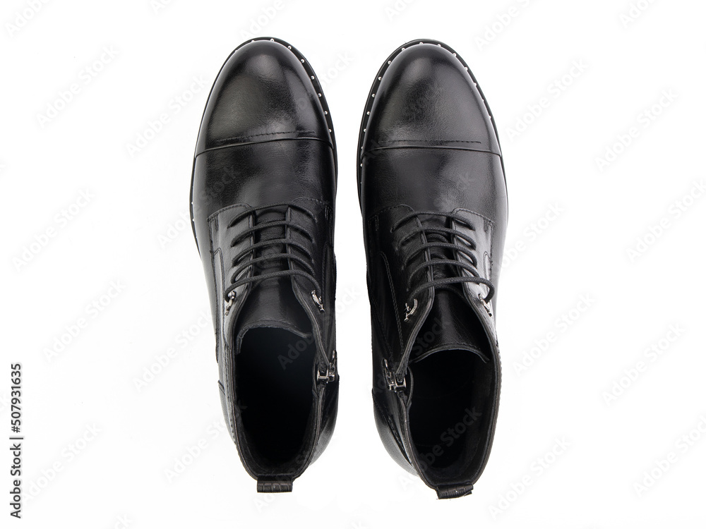 A pair of classic leather elegant men's shoes isolated white background. Groom's stylish black shoes. Isolated object close up on white background.