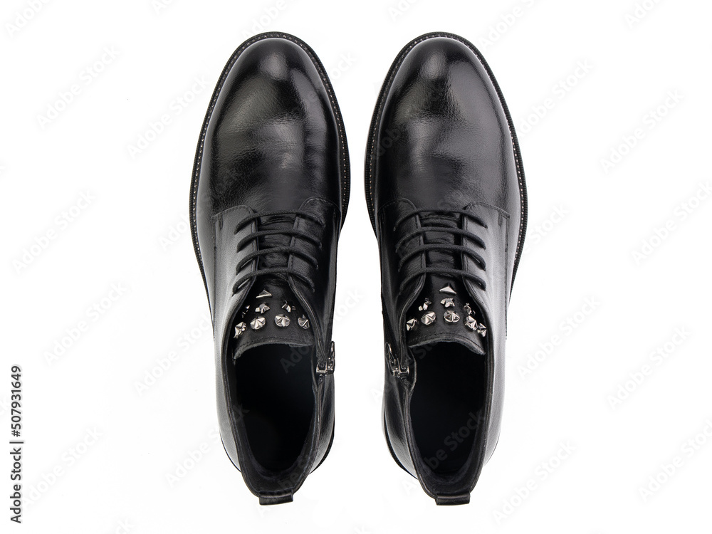 A pair of classic leather elegant men's shoes isolated white background. Groom's stylish black shoes. Isolated object close up on white background.