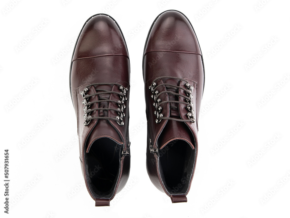 A pair of classic leather elegant men's shoes isolated white background. Groom's stylish black shoes. Isolated object close up on white background.
