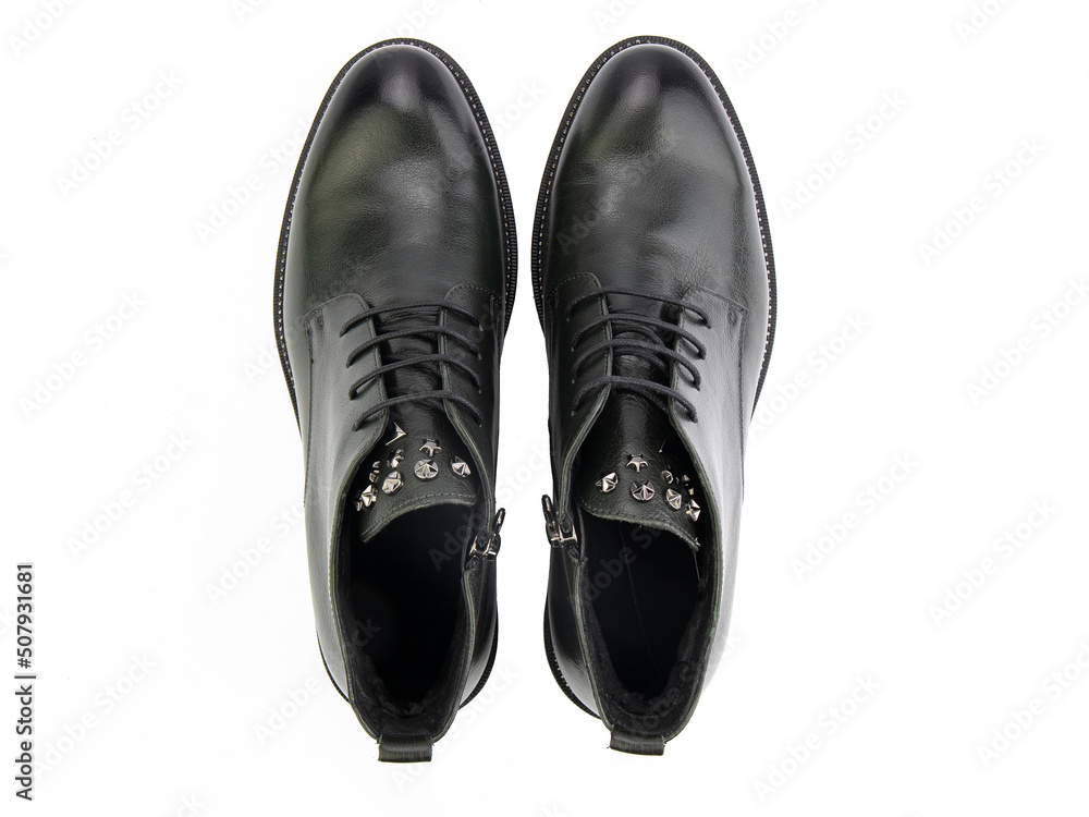 A pair of classic leather elegant men's shoes isolated white background. Groom's stylish black shoes. Isolated object close up on white background.