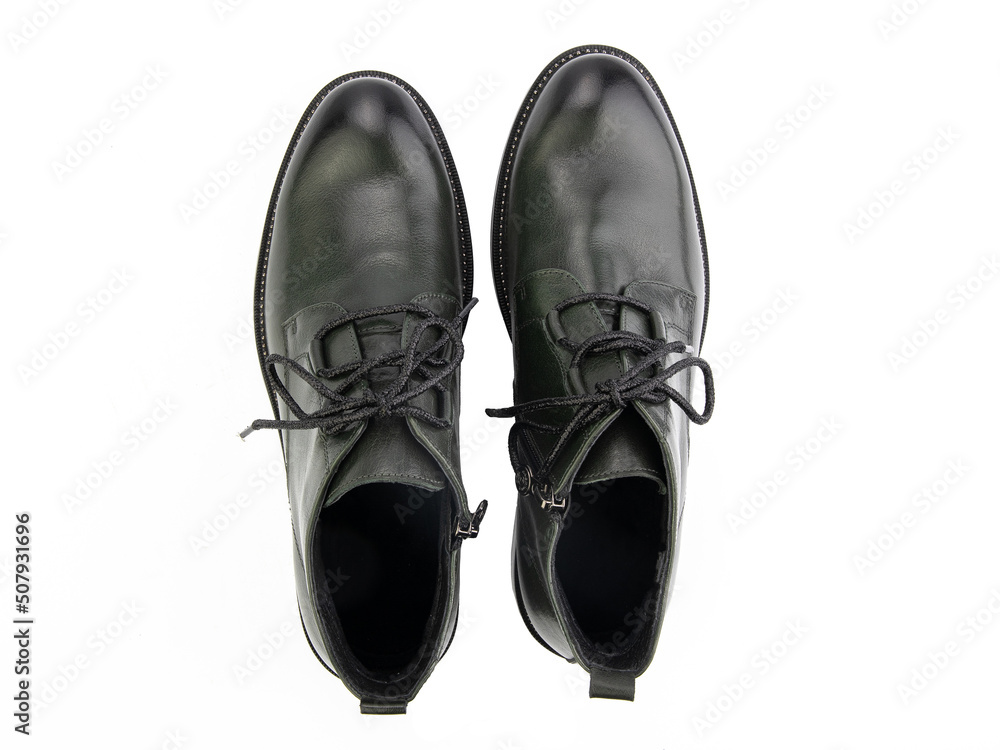 A pair of classic leather elegant men's shoes isolated white background. Groom's stylish black shoes. Isolated object close up on white background.
