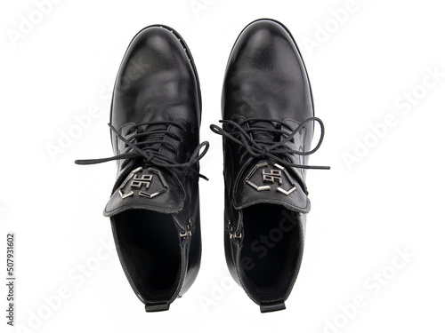 Obraz na płótnie A pair of classic leather elegant men's shoes isolated white background. Groom's stylish black shoes. Isolated object close up on white background. w salonie