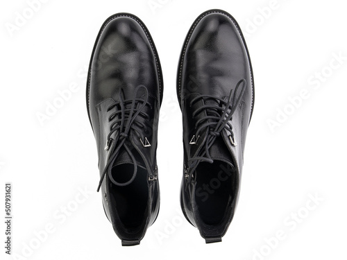 Obraz na płótnie A pair of classic leather elegant men's shoes isolated white background. Groom's stylish black shoes. Isolated object close up on white background. w salonie