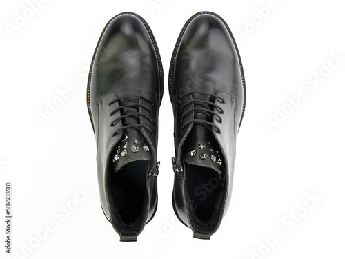 Obraz na płótnie A pair of classic leather elegant men's shoes isolated white background. Groom's stylish black shoes. Isolated object close up on white background. w salonie