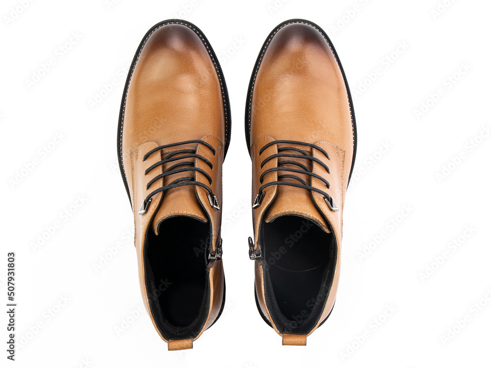 A pair of classic leather elegant men's shoes isolated white background. Groom's stylish black shoes. Isolated object close up on white background.