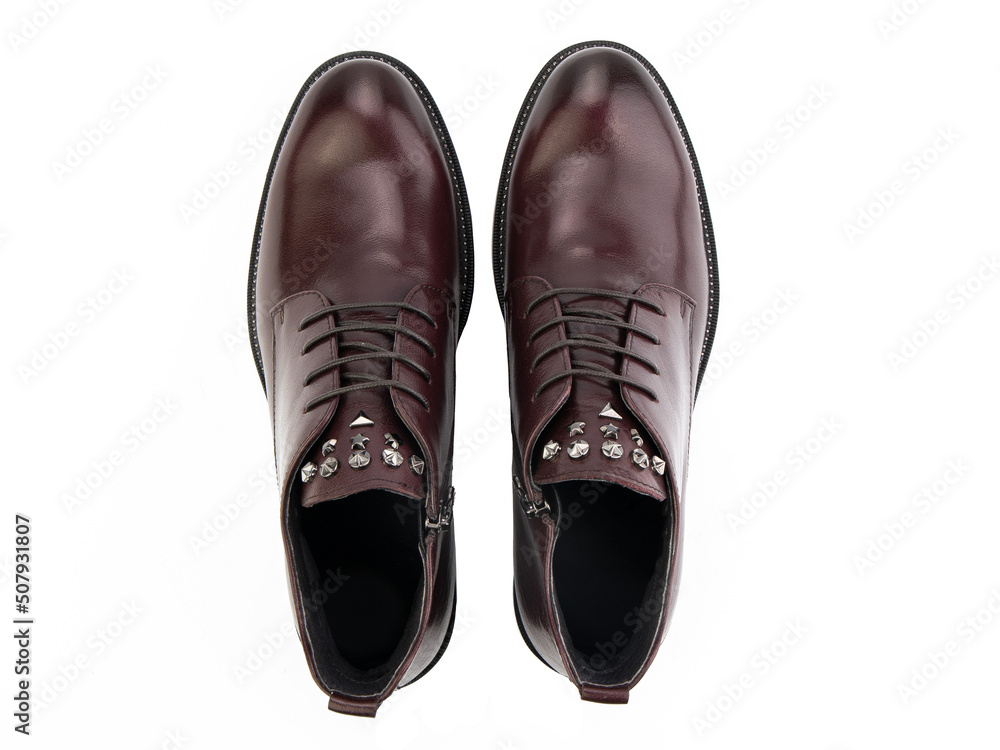A pair of classic leather elegant men's shoes isolated white background. Groom's stylish black shoes. Isolated object close up on white background.