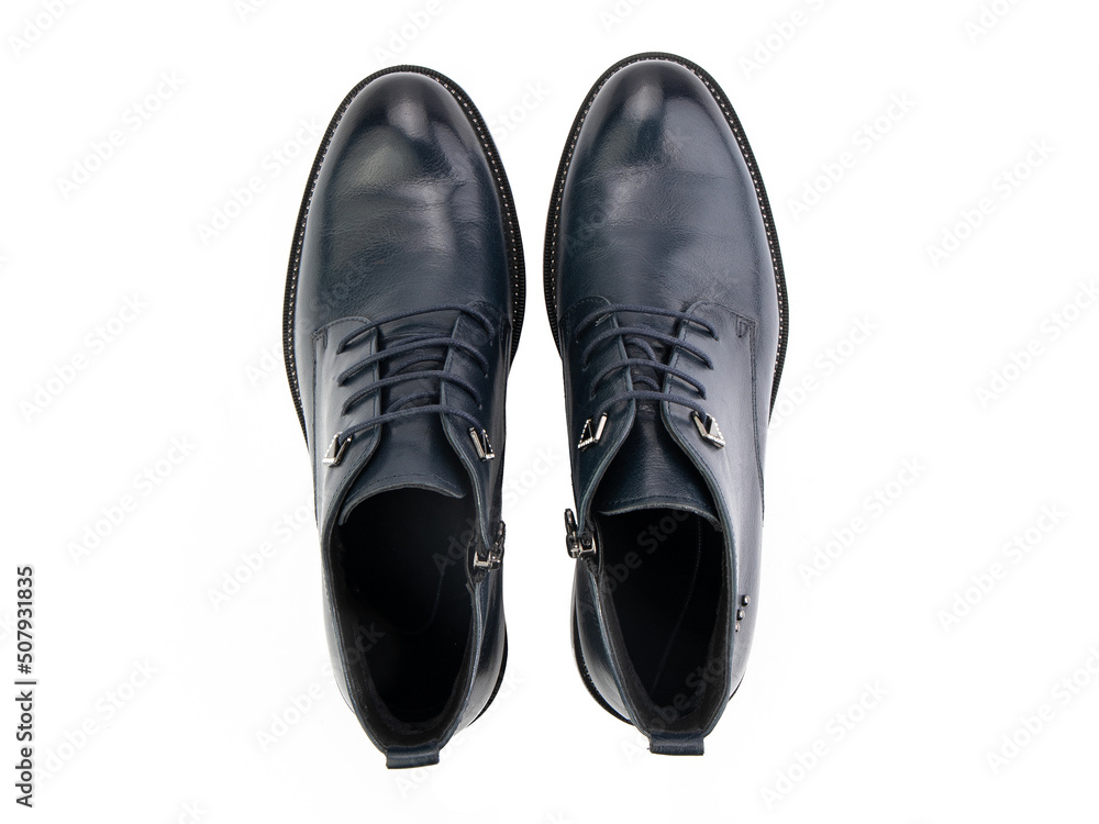 A pair of classic leather elegant men's shoes isolated white background. Groom's stylish black shoes. Isolated object close up on white background.