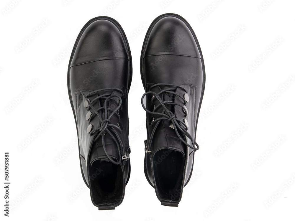 A pair of classic leather elegant men's shoes isolated white background. Groom's stylish black shoes. Isolated object close up on white background.