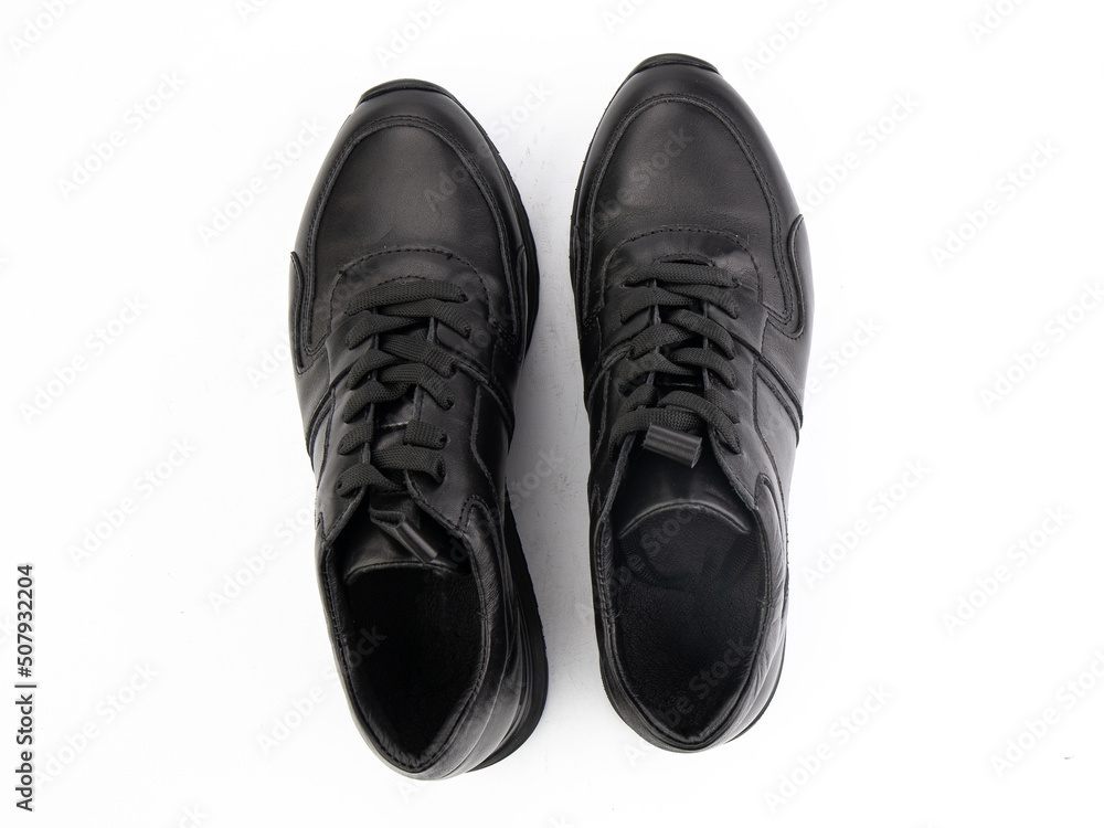 A pair of classic leather elegant men's shoes isolated white background. Groom's stylish black shoes. Isolated object close up on white background.