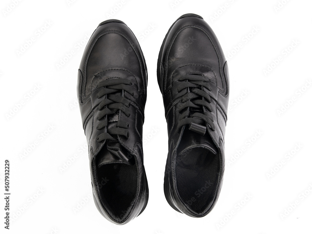 A pair of classic leather elegant men's shoes isolated white background. Groom's stylish black shoes. Isolated object close up on white background.