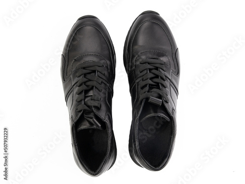 Obraz na płótnie A pair of classic leather elegant men's shoes isolated white background. Groom's stylish black shoes. Isolated object close up on white background. w salonie