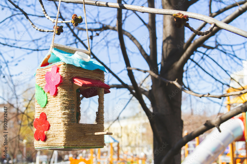 Bird feeders. Feeding birds in the forest. Birdhouse on a tree. Bird feeders. Feeding birds in the forest. Birdhouse on a tree.