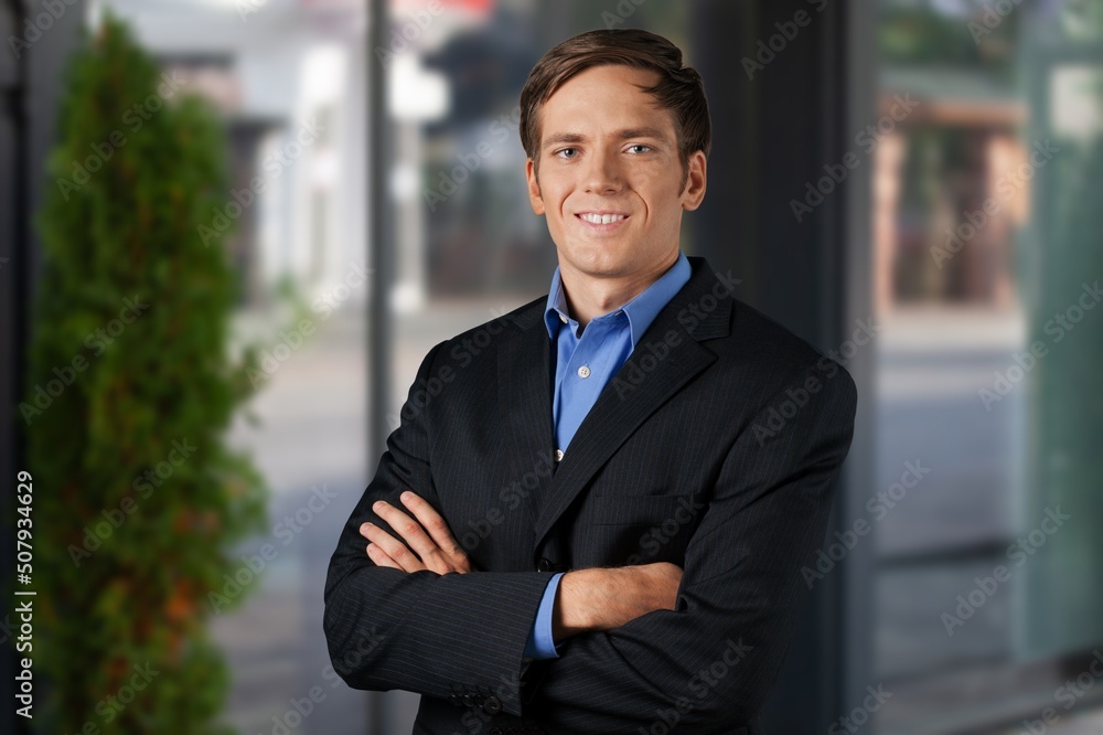 Confident happy successful ceo financial manager standing in modern office Confident happy successful ceo financial manager standing in modern office