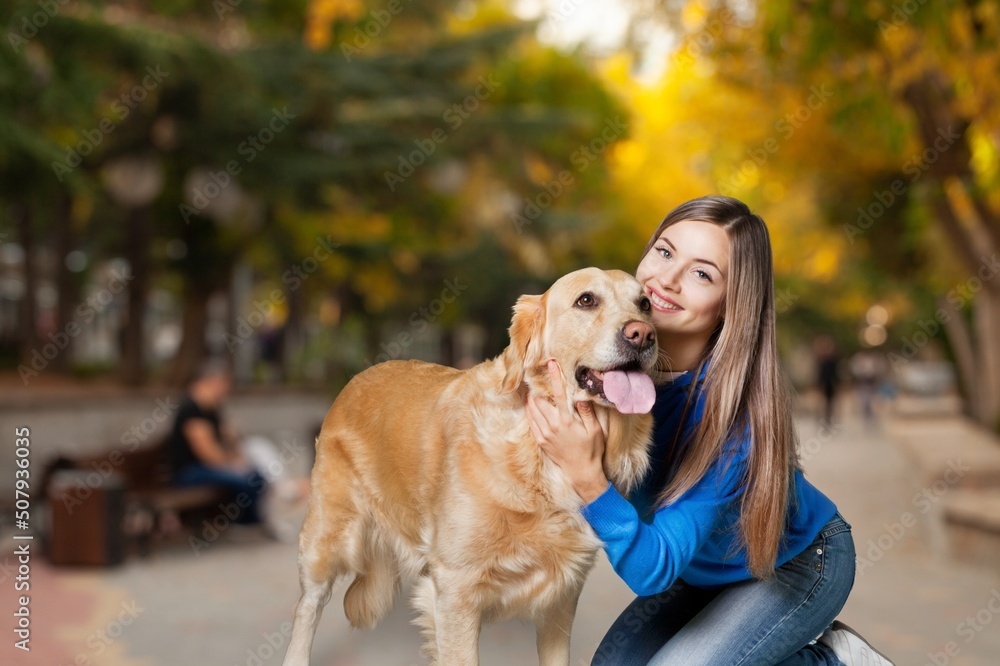 Happy Caucasian woman dressed resting hugging and stroke lovely pet