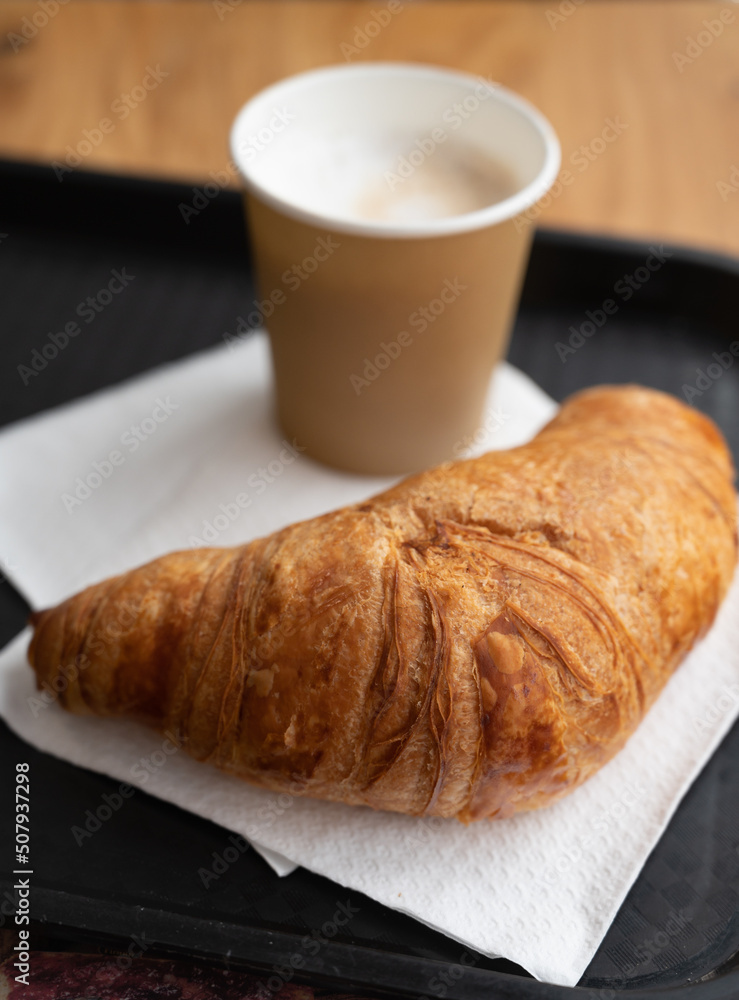Coffe and croissant, french breakfast takeaway in bakery Coffe and croissant, french breakfast takeaway in bakery