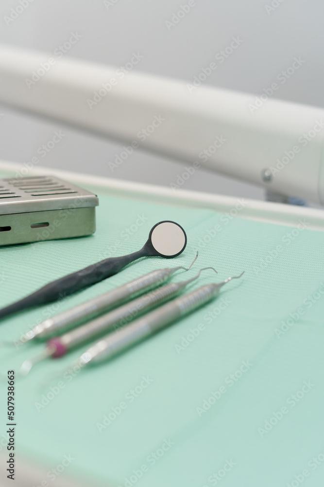 various professional dental instruments, arranged on the work table in an orderly manner, medical office details, objects