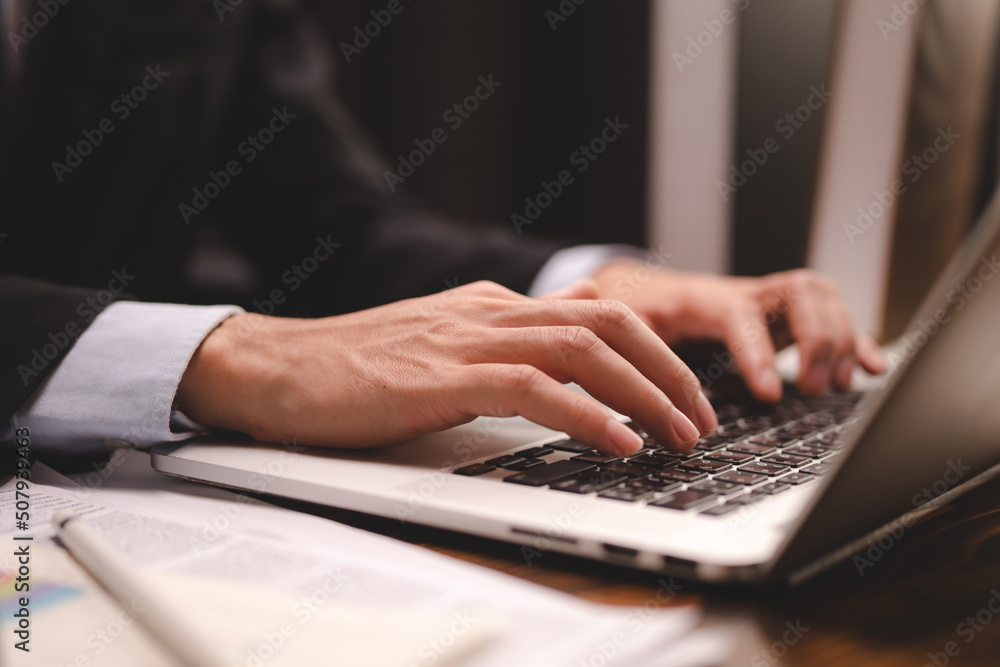 professional business person are working in communication of online marketing job plan with laptop by using a hand to typing computer keyboard at modern office workplace or co-working space professional business person are working in communication of online marketing job plan with laptop by using a hand to typing computer keyboard at modern office workplace or co-working space