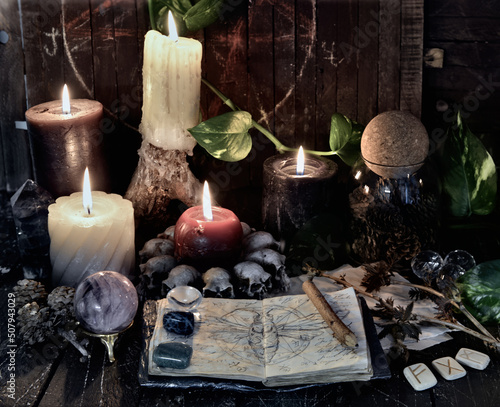 Wicca, esoteric and occult still life with vintage magic objects and book on witch table altar for mystic rituals and fortune telling. Halloween and gothic concept