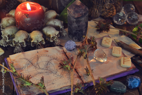 Wicca, esoteric and occult still life with vintage magic objects and open book on witch table altar for mystic rituals and fortune telling. Halloween and gothic concept