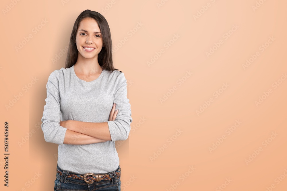 Business lady crossed arms on color background Business lady crossed arms on color background