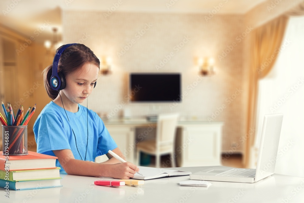 Elementary school girl studying for entrance exams at home Elementary school girl studying for entrance exams at home