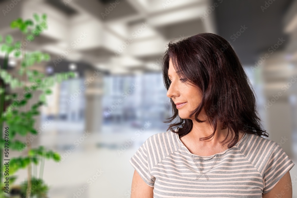 Peaceful thoughtful young woman in casual looking at window away Peaceful thoughtful young woman in casual looking at window away
