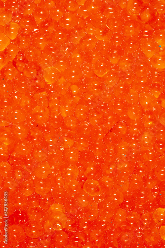 Red caviar as an abstract background.