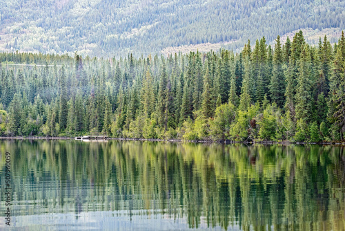 A boat dock across the water at Kiniskan Lake Provincial Park in British Columbia, Canada