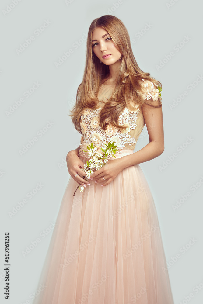Beautiful Woman in Lace Wedding Dress. Beautiful Lady with Healthy and Beauty Hair. Woman with a peony Beautiful Woman in Lace Wedding Dress. Beautiful Lady with Healthy and Beauty Hair. Woman with a peony