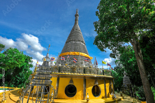 Background of religious sights on high mountains in Hat Yai District of Thailand (Phra Maha Ruesee Chedi Tripob Trimongkol) is a beautiful stainless steel pagoda, tourists always come to make merit du