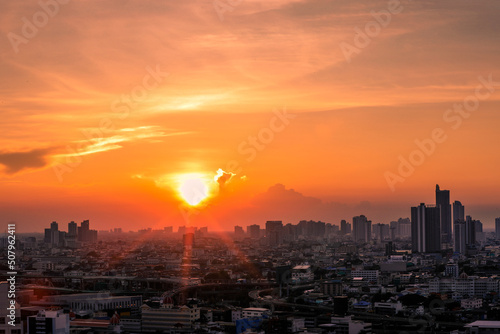 The high angle background of the city view with the secret light of the evening  blurring of night lights  showing the distribution of condominiums  dense homes in the capital community