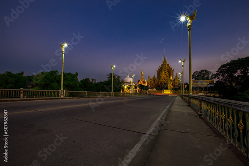 The background of religious attractions in Phitsanulok Province (Wat Chan Tawan Tok) has a distinctive golden yellow sculpture, close to the Nan River, tourists always come to make merit in Thailand