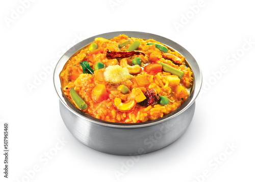 South Indian traditional Bisi Belebath or sambar rice in a bowl on a white background photo