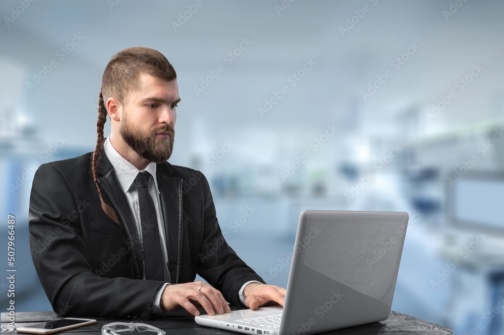 Young Businessman Using Laptop Computer Sitting During Break Young Businessman Using Laptop Computer Sitting During Break