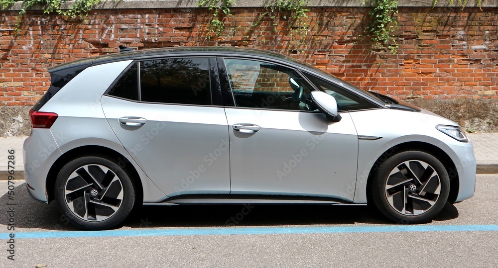 Udine, Italy. May 30, 2022. New silver gray Volkswagen ID.3 Pro on brick  wall background. It is a full electric small family car of the german  automaker. Stock-Foto | Adobe Stock