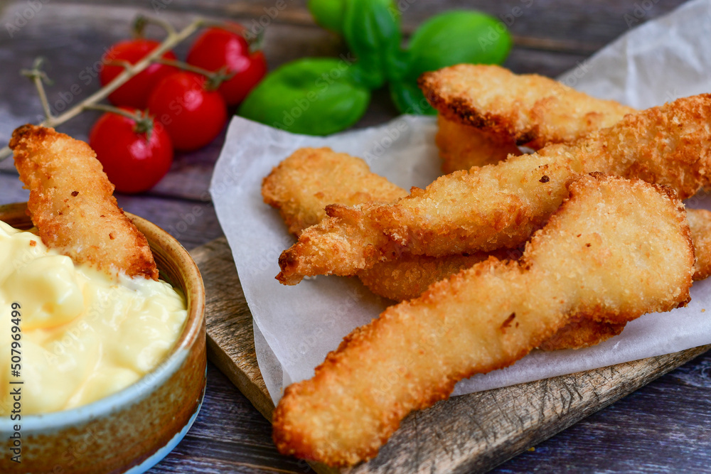 Crispy deep Fried home made Chicken strips Breaded with almond flour chicken breast fillets with chilly peppers and fresh basil on wooden rustic background. Ketogenic diet food
Crispy deep Fried home made Chicken strips Breaded with almond flour chicken breast fillets with chilly peppers and fresh basil on wooden rustic background. Ketogenic diet food