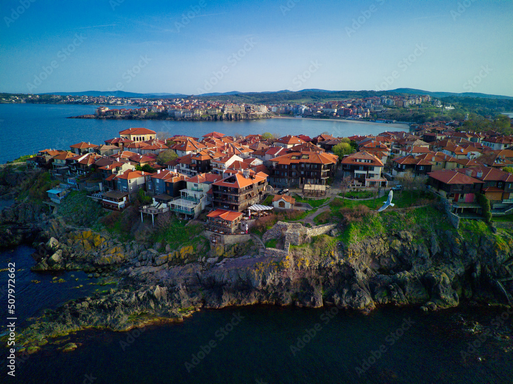 Fototapeta premium iew from a height of the city of Nessebar with houses and parks washed by the Black Sea in Bulgaria