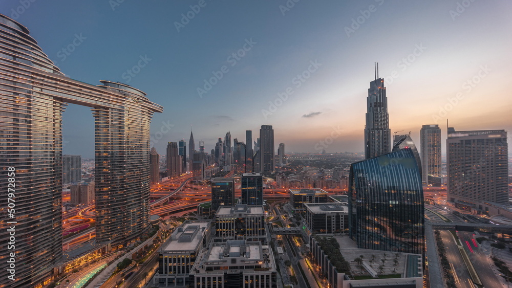Fototapeta premium Futuristic Dubai Downtown and finansial district skyline aerial night to day timelapse.
