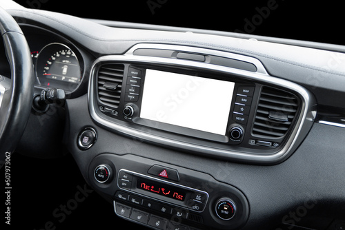 Monitor in car with isolated blank screen use for navigation maps and GPS. Isolated on white with clipping path. Car display with blank screen. Modern car black leather interior details.