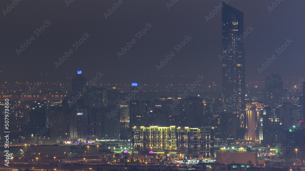 Buildings around Deira and creek district in Dubai night timelapse. Dubai, UAE.
