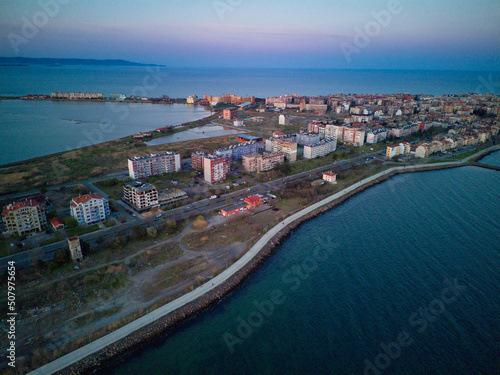 View from a height above the town of Pomorie with houses and streets washed by the Black Sea in Bulgaria © YouraPechkin