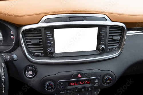 Monitor in car with isolated blank screen use for navigation maps and GPS. Isolated on white with clipping path. Car display with blank screen. Modern car brown leather interior details.