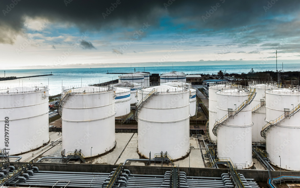 Dark clouds over the oil product storage terminal. Dark clouds over the oil product storage terminal.