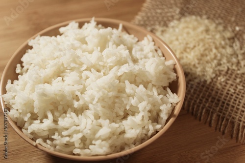 Cup of rice. Boiled rice in a bowl. steamed white rice in a ceramic bowl. photo