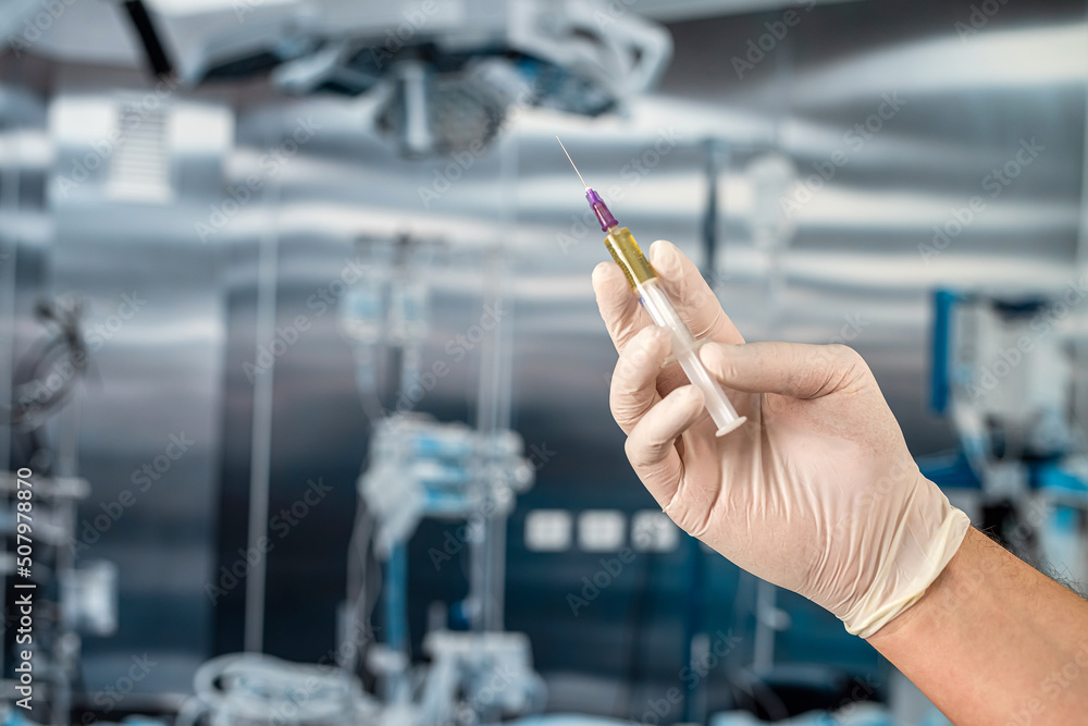 hands of medical assistant wear gloves and preparing syringe for inject anesthesia hands of medical assistant wear gloves and preparing syringe for inject anesthesia