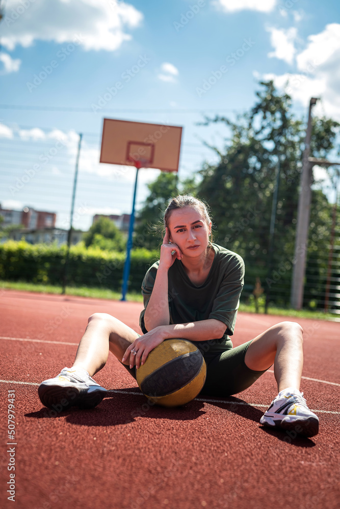 charm young woman with basketball on sports playground charm young woman with basketball on sports playground