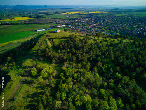 A view from a height of the meadows and slopes of the Balkan Mountains under daylight in Bulgaria