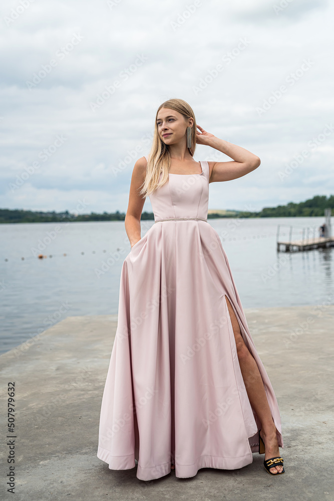 fantasy charming woman in elegant ping evening dress relaxing near lake fantasy charming woman in elegant ping evening dress relaxing near lake