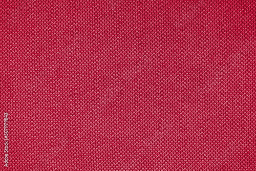 Texture background of velours pink fabric. Fabric texture of upholstery furniture textile material, design interior, wall decor. Fabric texture close up, backdrop, wallpaper.